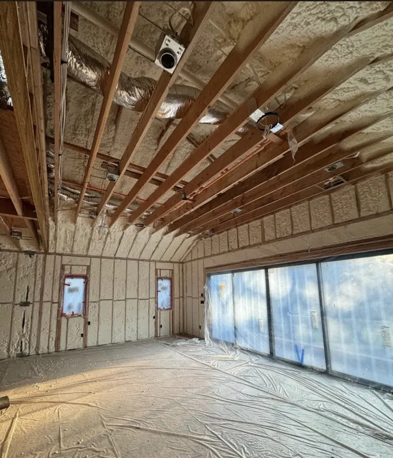 Interior walls and ceiling insulated with spray foam during new construction in Fort Worth